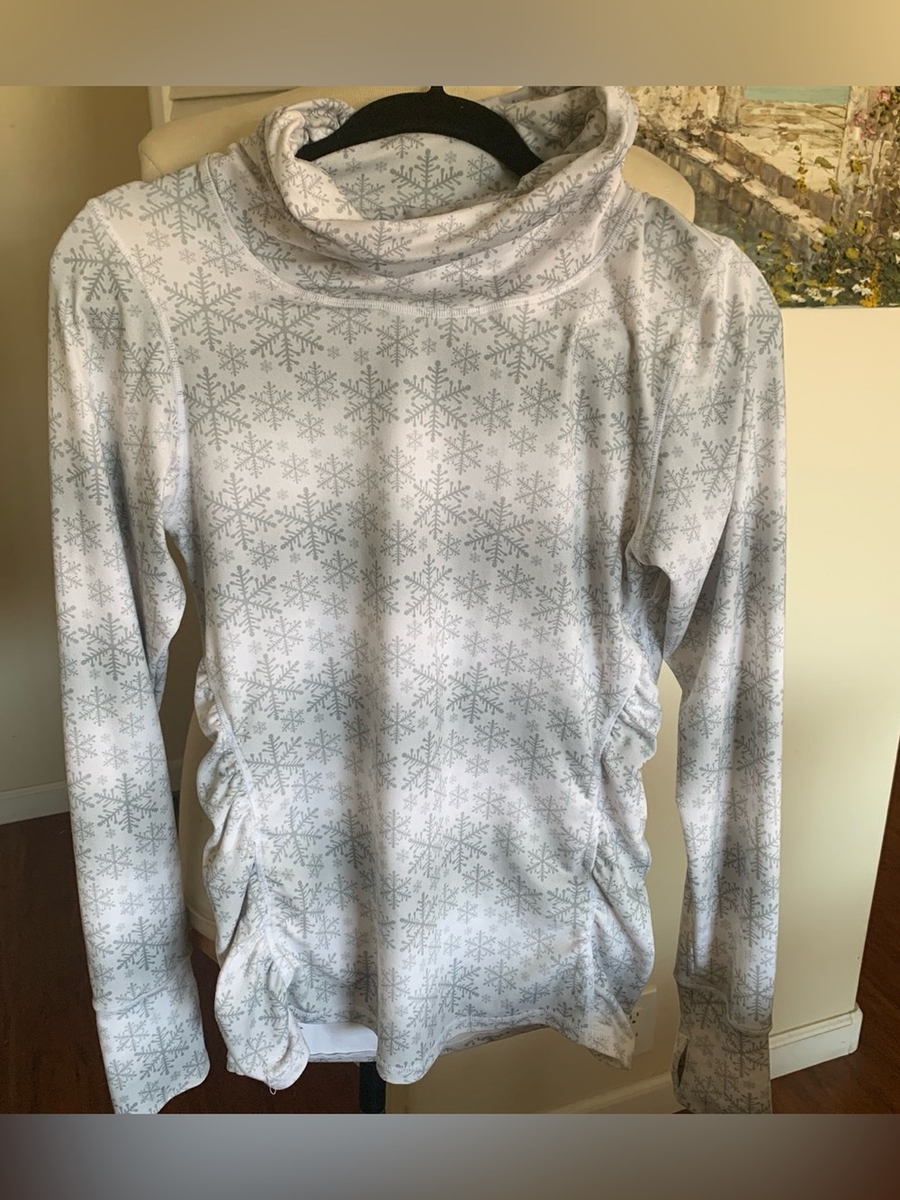 Women’s White Snowflake Cowl Neck Long-Sleeve Top, with side shearing.